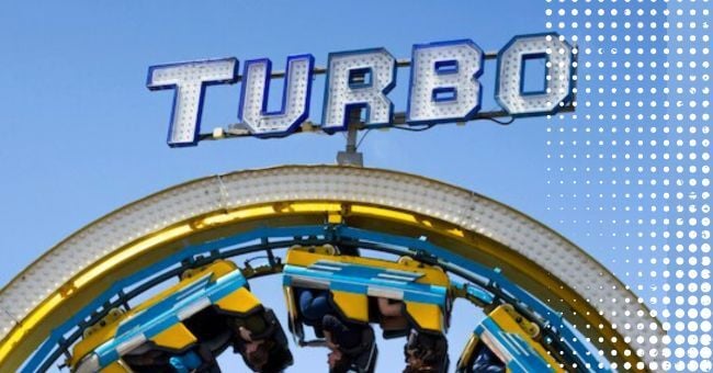 People on a yellow rollercoaster with the word Turbo above them
