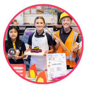 3 students showing off career ideas at a school expo - firefighter baker and builder