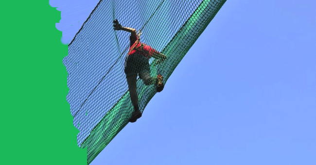Making maths real for life. A student plays in a net in a rope course, with a green border to one side